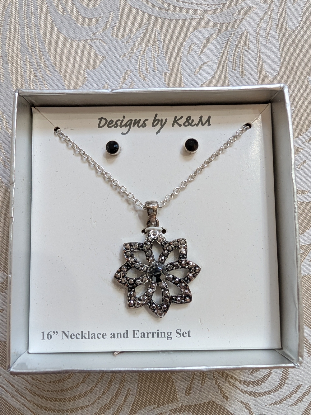 Silver Floral Pendant Necklace with Black Stones